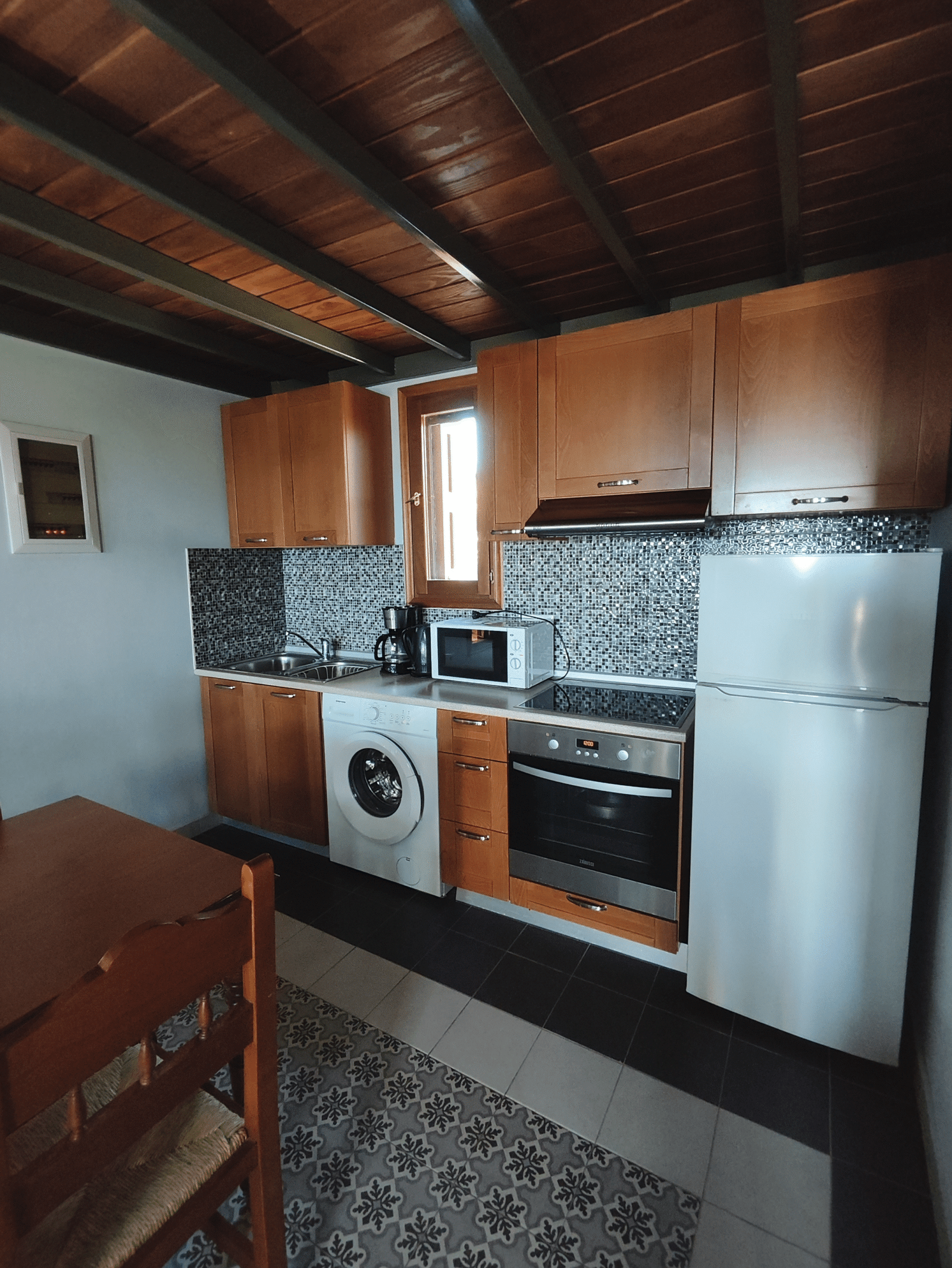 Fully equipped kitchen inside Alisahni Villas in Kiotari, Rhodes.