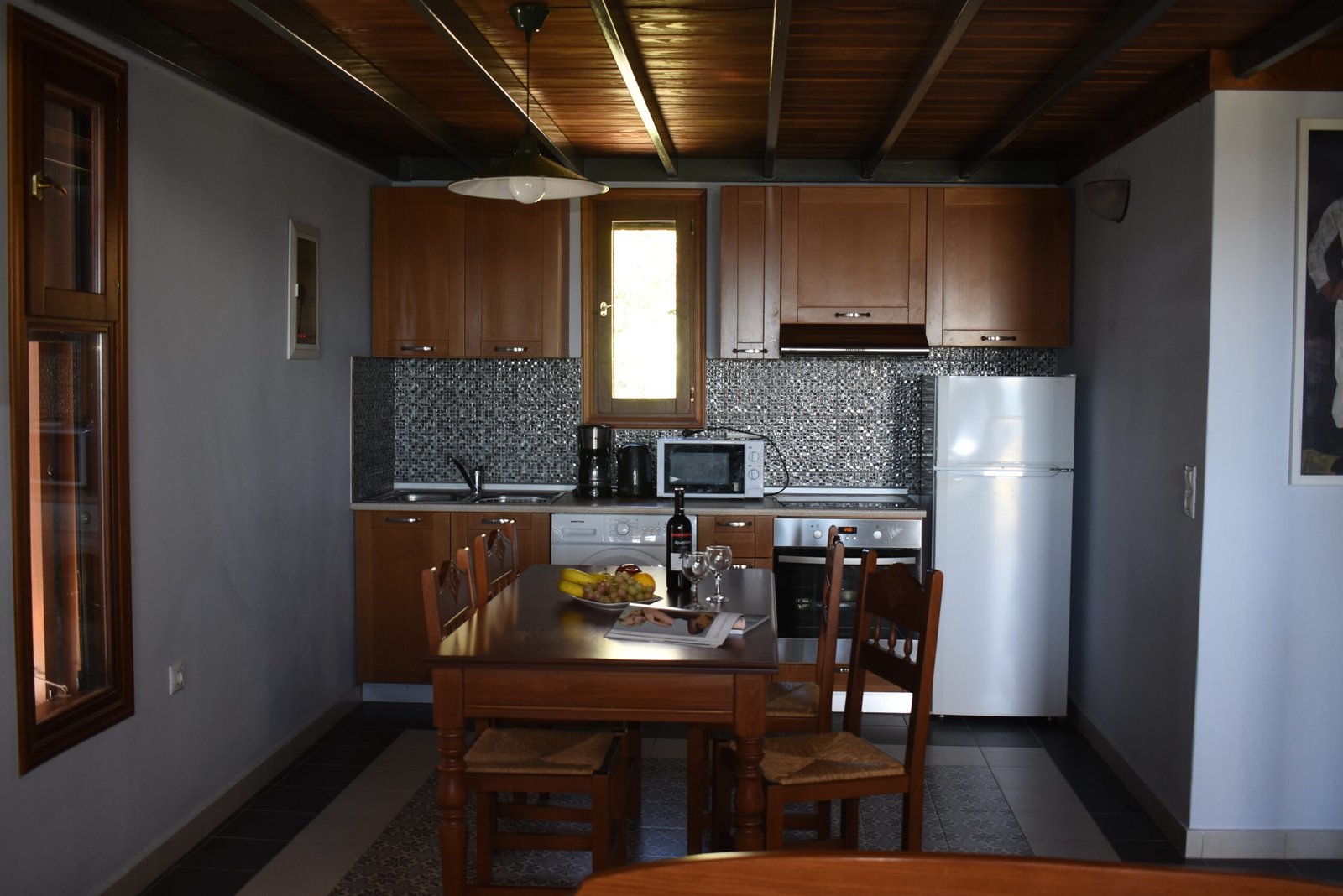Kitchen and dining area inside Alisahni Villas in Kiotari, Rhodes.